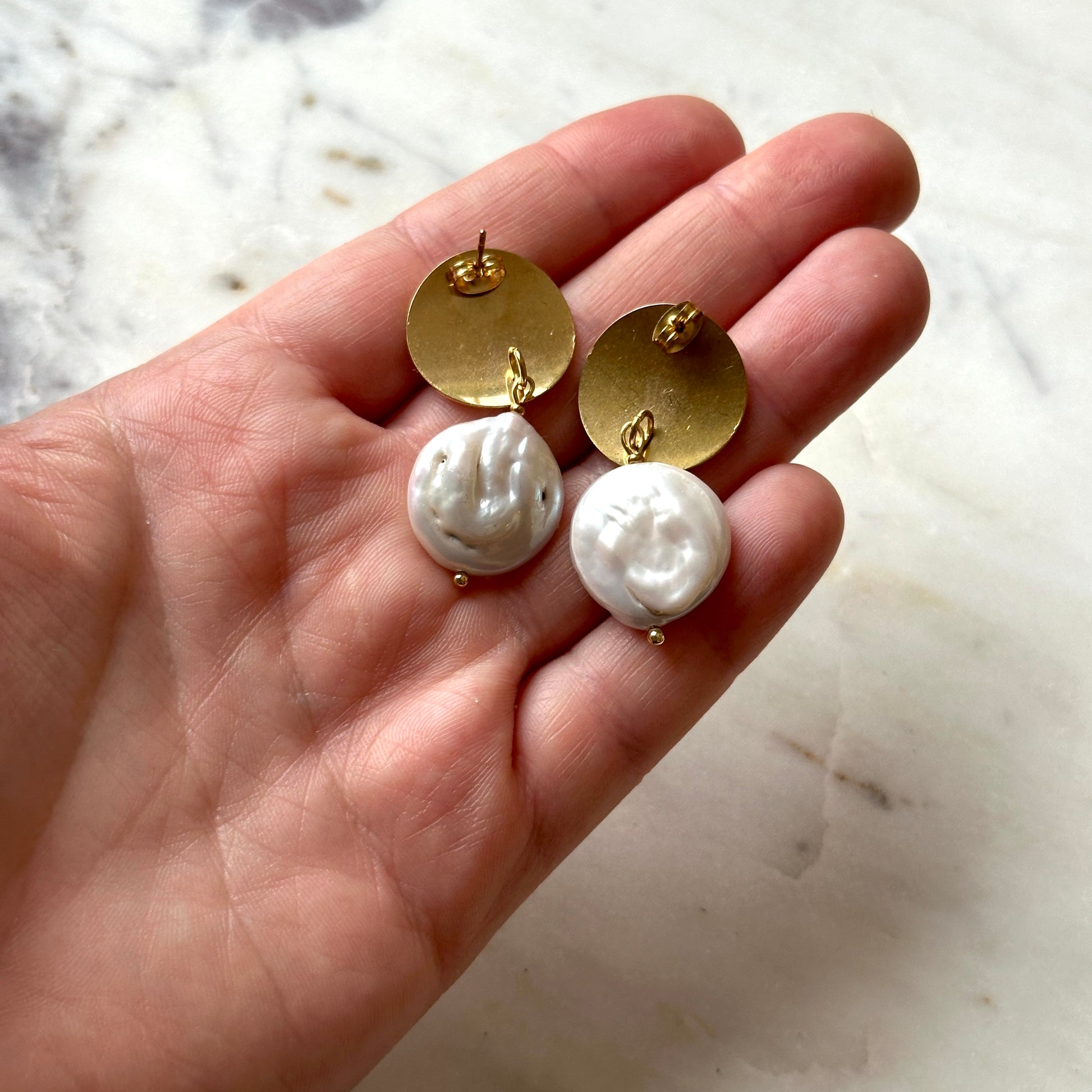 Pearl earrings on a gold stud