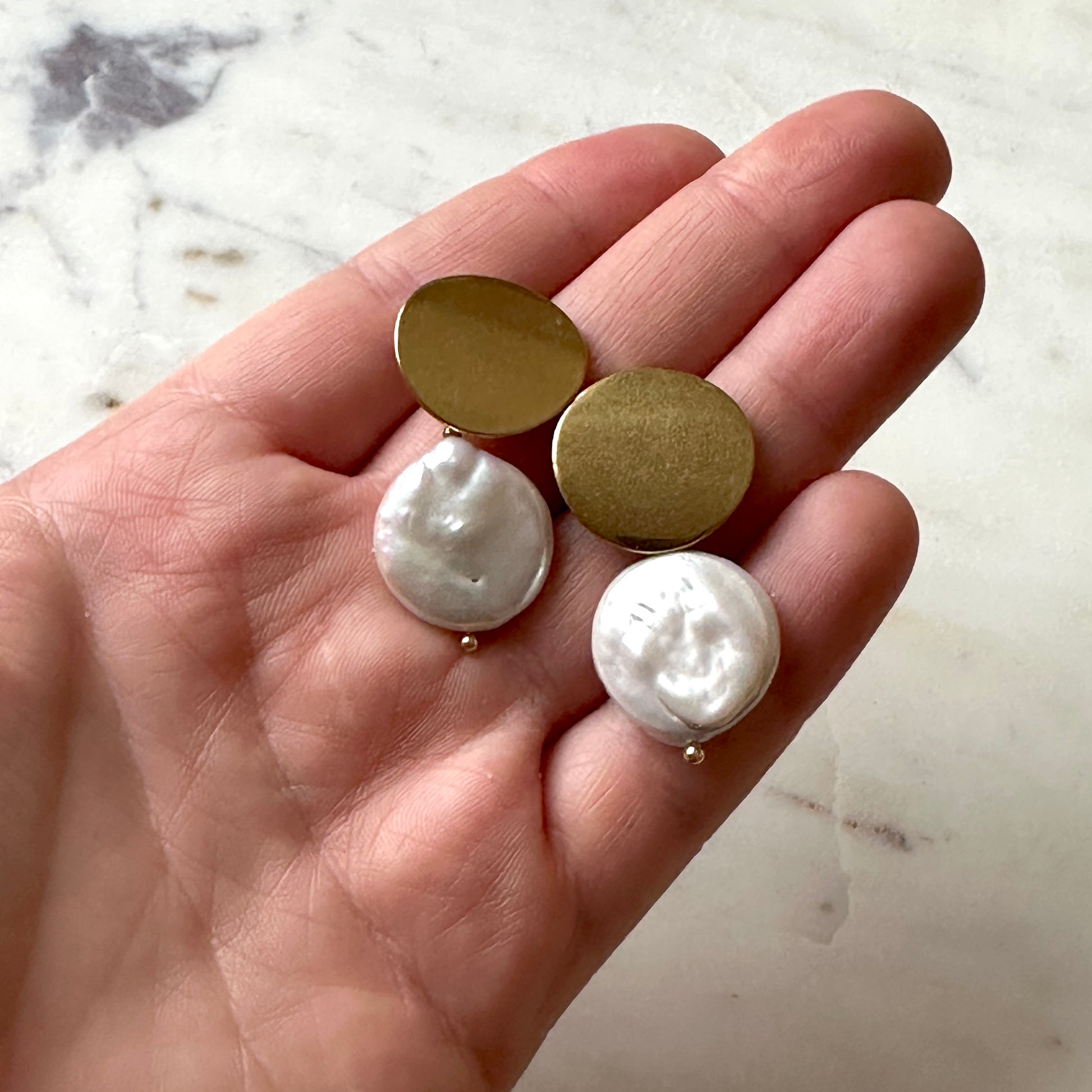 Pearl earrings on a gold stud