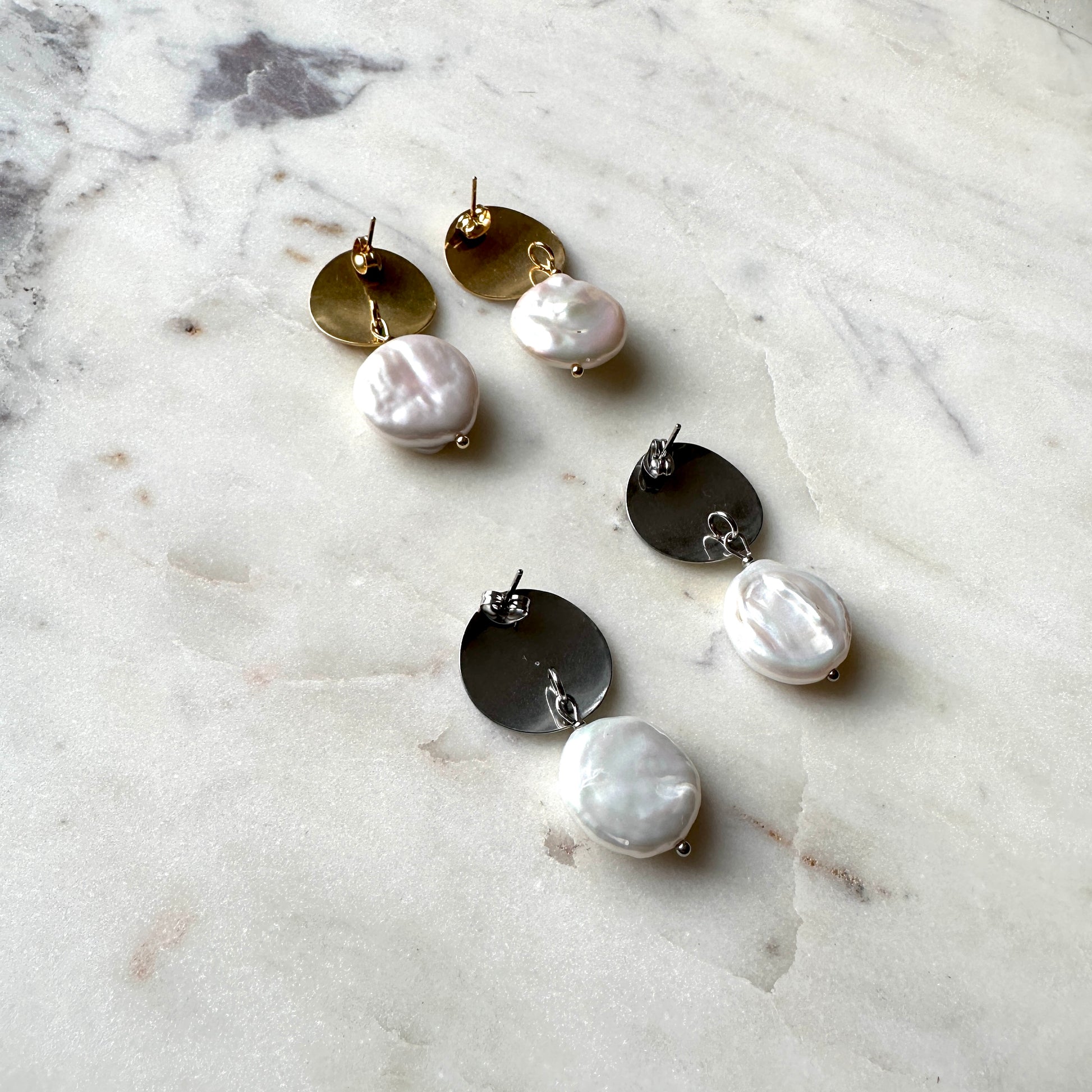 Pearl earrings on a gold and silver stud