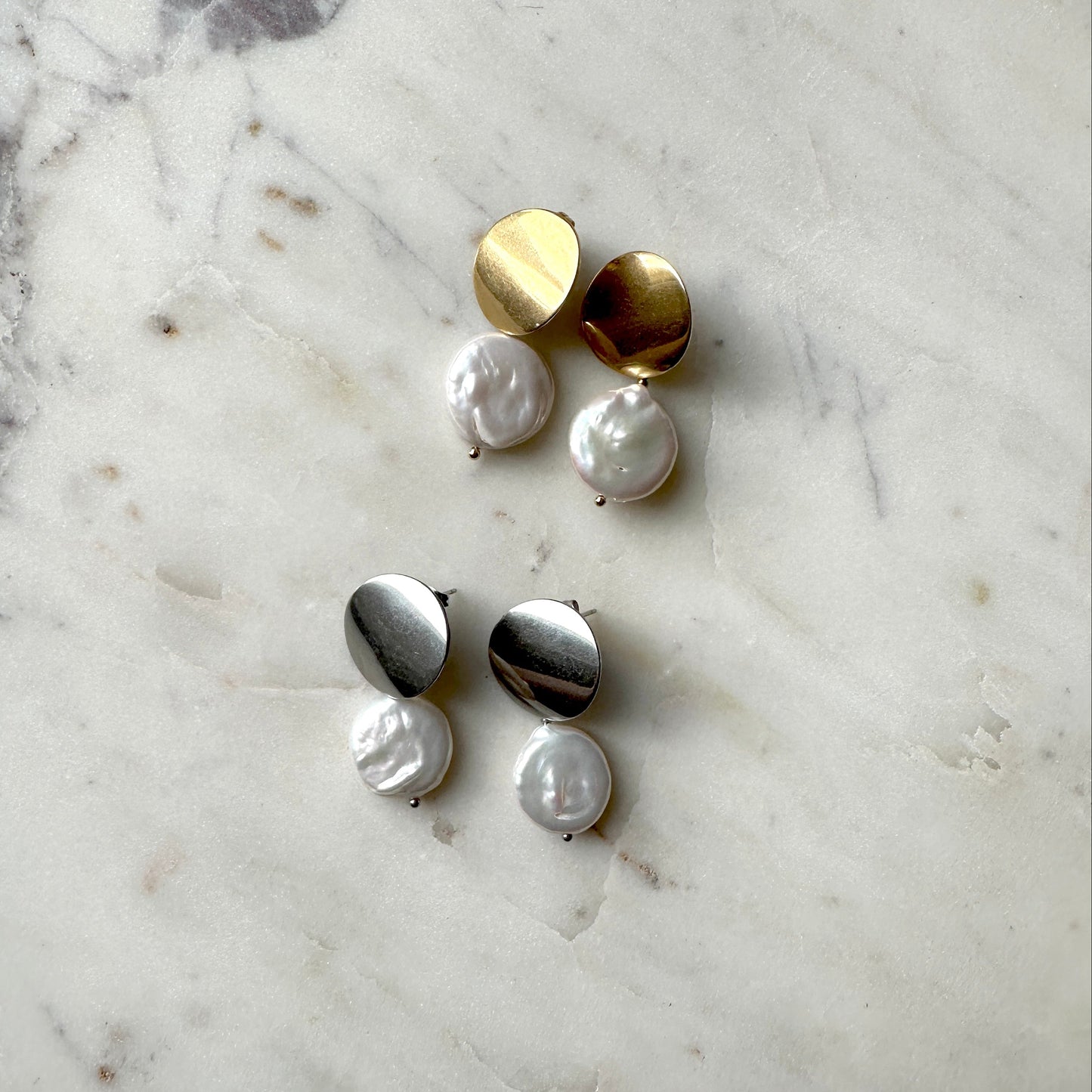 Pearl earrings on the gold and silver stud