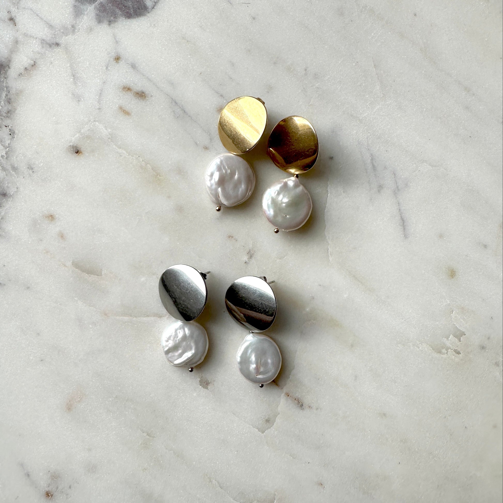 Pearl earrings on the gold and silver stud