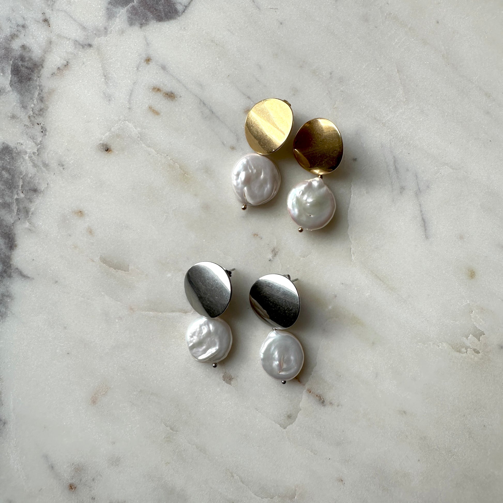 Pearl earrings on a gold and silver stud